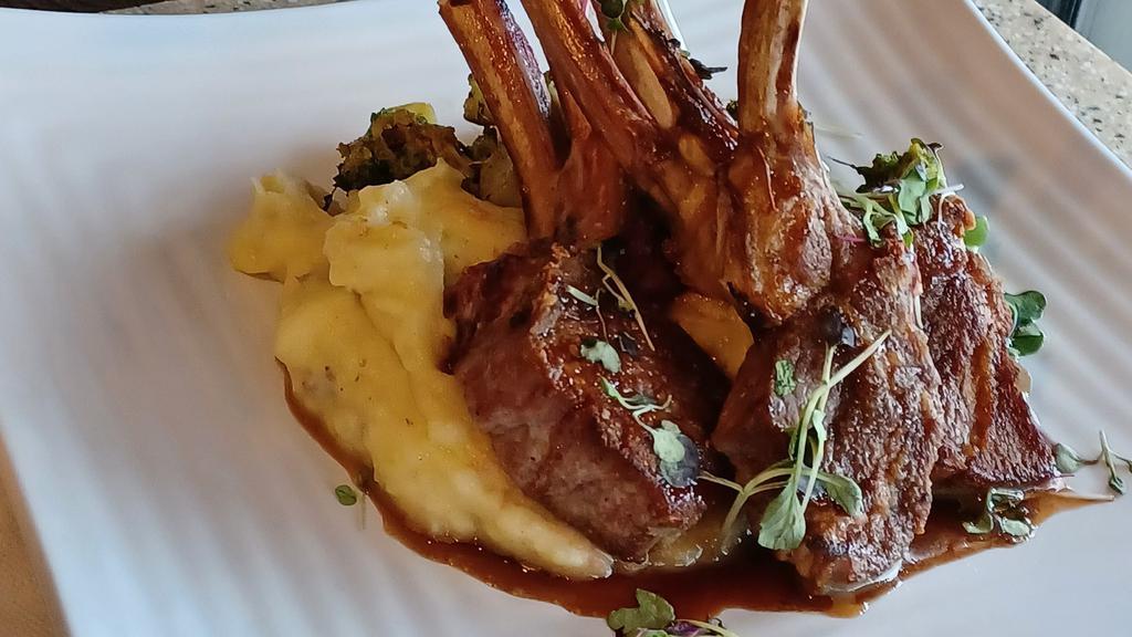 Lamb Chop Entrée · Grilled lamb chops served with two sides, served with a beef demi-glace.