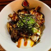Chashu Don · Pork over rice with poached egg, scallion, nori flakes & chef special sauce.