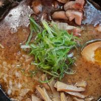 Zurutto Kuro · Chicken broth, black garlic oil, organic chicken, seasoned boiled egg, scallion, onion, and ...