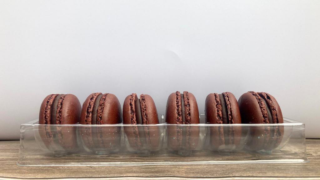 Box Of 6 Chocolate'S Macarons · Box of 6 macarons. A small round cake with a meringue-like consistency, made with egg whites, sugar, and powdered almonds. Consisting of two halves sandwiching a creamy filling.