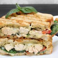 Pesto Chicken Panini · Grilled chicken with pesto sauce, mozzarella cheese and roasted peppers.