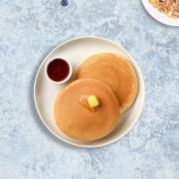 Just The Pancakes · Fluffy pancakes cooked with care and love served with butter and maple syrup. Three pieces.