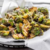 Crispy Brussels Sprouts · Flash fried Brussels sprouts tossed in Parmesan truffle salt. Finished with balsamic glaze a...