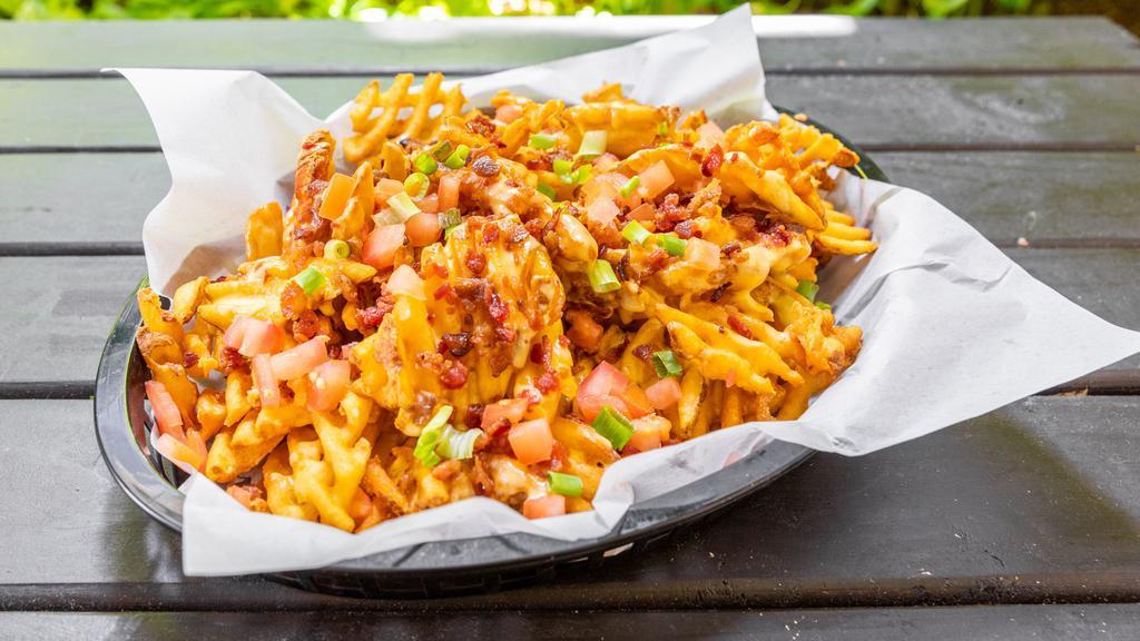 Loaded Fries · Bacon, cheese, tomato and green onion.