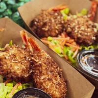 Coconut Shrimp · Butterflied shrimp coated in coconut panko. Deep fried and served with sweet chili sauce.