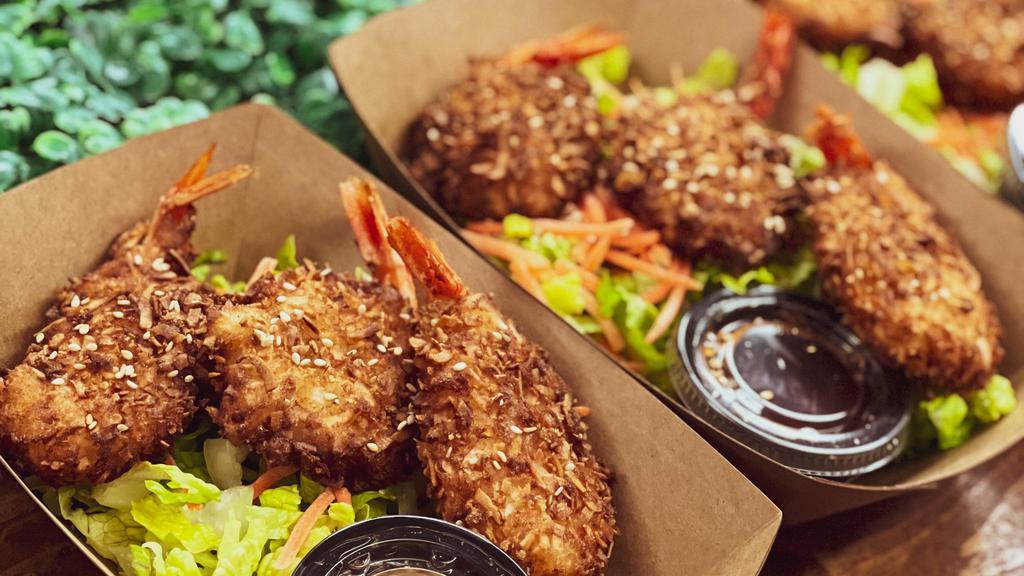 Coconut Shrimp · Butterflied shrimp coated in coconut panko. Deep fried and served with sweet chili sauce.