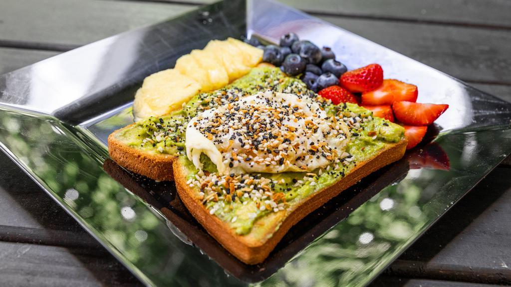 Avocado Toast · Seasoned avocado smash served on your choice of toast. Topped with a fried egg and everything bagel seasoning. Served with a side of fruit.
