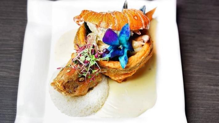 Red Snapper · Filled with seafood in white sauce, choice of side.