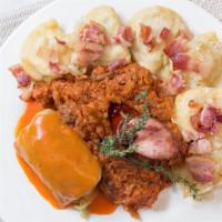 Plate A La Warsaw · Stuffed cabbage topped with tomato sauce, polish kielbasa, mixed pierogies, and hunter’s stew.