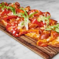 Coca De Chorizo · Flatbread with chistorra sausage,	roasted peppers and manchego cheese