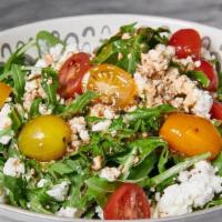 Ensalada De Queso · Aragula salad with goat cheese, cherrie tomato and crushed almonds ( add chicken or steak fo...