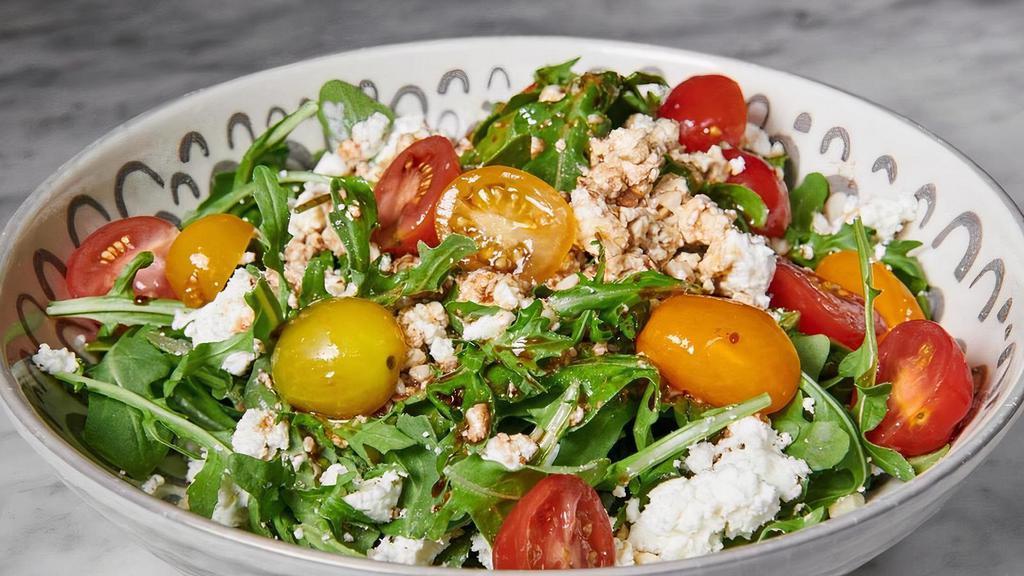 Ensalada De Queso · Aragula salad with goat cheese, cherrie tomato and crushed almonds ( add chicken or steak for6$ )
