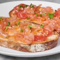 Pan Con Tomate · Grilled bread rubbed with tomato, garlic and olive oil.
