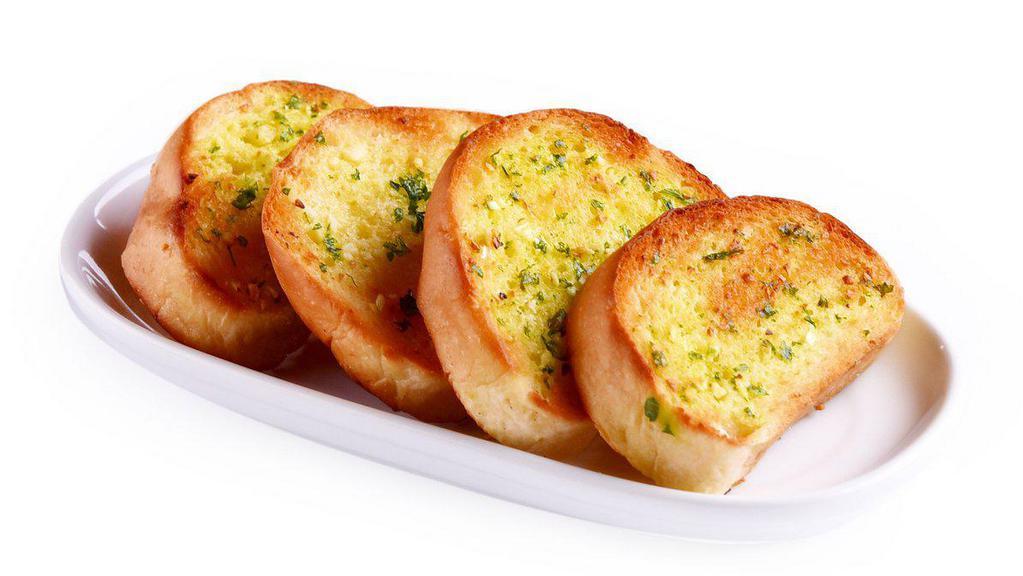 Cheesy Garlic Bread · House made cheesy bread prepared with fresh garlic, warm butter, and herb seasoning.