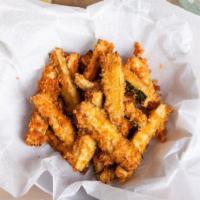 Crispy Zucchini Sticks · Fresh zucchini breaded and crisped to perfection and served with a side of house made marina...