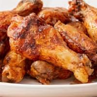 Chicken Wings · 8 pcs Fresh bone-in chicken wings breaded and crisped to perfection then tossed in choice of...