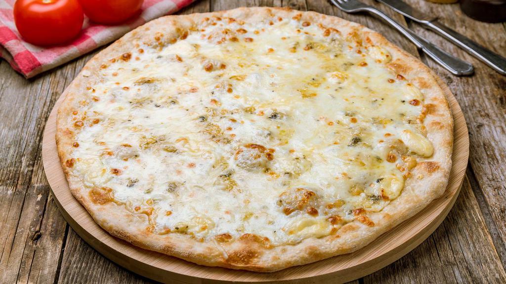 White Pizza · Ricotta, mozzarella, and parmesan cheese on a fresh baked sauceless pizza.