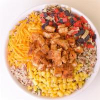 My Spicy Chicken Bowl · Served with baby kale, cajun grilled chicken, cheddar, corn, lime chipotle vinaigrette, orga...