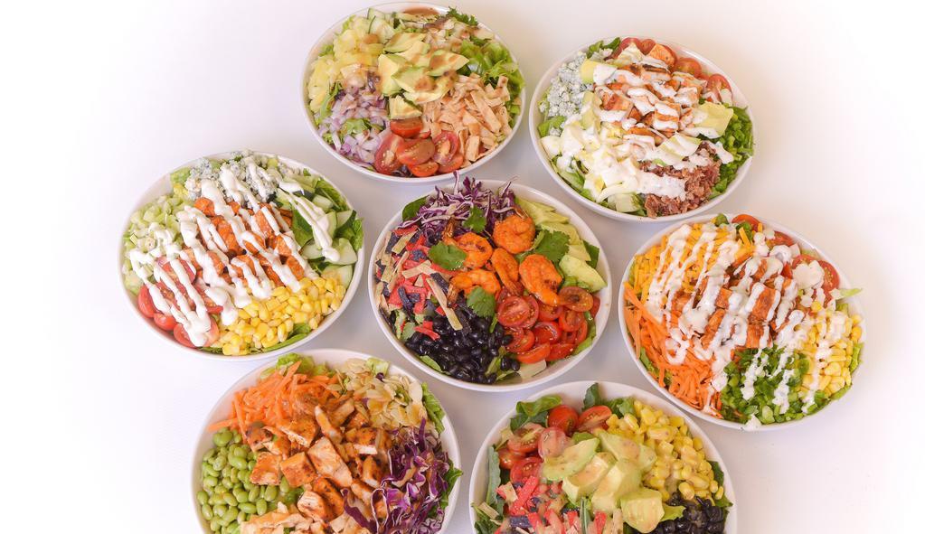 Create Your Own Salad · Choose your base, seven toppings, and a dressing. Extra toppings, proteins, premiums, dressings, and soup add-ons are an additional charge.