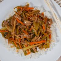 Szechuan Beef · Tender beef stir-fried with green peppers, onion, bamboo shoots, carrots and celery in a spi...