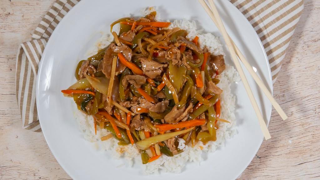 Szechuan Beef · Tender beef stir-fried with green peppers, onion, bamboo shoots, carrots and celery in a spicy chili sauce. Served with steamed rice. Hot and spicy.