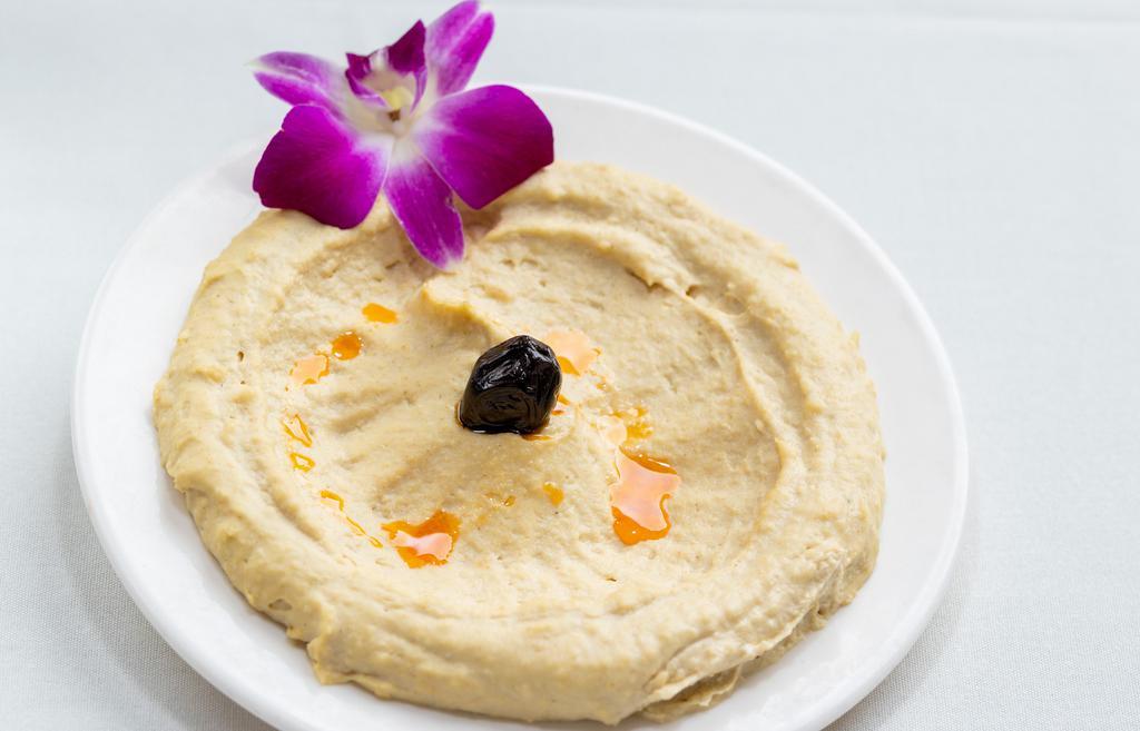 Hummus · Pureed chick peas with sesame oil and hint of garlic.