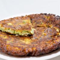Zucchini Pancake · Unique taste of zucchini served with yogurt sauce on the side.