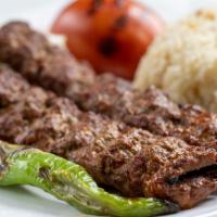 Adana Kebab · Skewered ground meat charcoal broiled beef patties marinated with our chef's seasoning. It i...