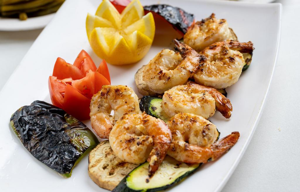 Shrimp Kebab · Grilled shrimp skewers are shrimp marinated in garlic, mustard and herbs. Served with rice and string beans.