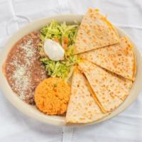 Quesadilla · Large flour tortilla with your choice of meat & Monterey Jack cheese. Served with rice, bean...