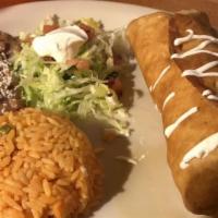Chimichanga · Large flour tortilla stuffed with Monterey Jack cheese & your choice of meat. Topped with so...