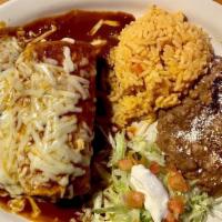 Monterey Burrito · Flour tortilla stuffed with rice, beans, Monterey Jack cheese & your choice of meat. Topped ...