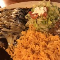 Enchiladas De Mole · Rolled corn tortillas with your choice of meat. Topped with sweet and spicy sauce, and melte...