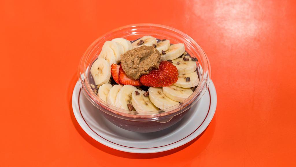 Almond Butter Acai Bowl · Another popular classic bowl blended thickly with almond milk, banana, strawberry, almond butter, and tropical organic acai. Topped with granola, banana, strawberry, blueberry, and cacao nib.
