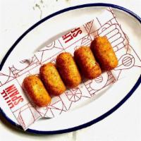 Croquetas De Pollo · Bechamel with chicken fritters. Allergy: This item contains egg, dairy, and gluten.