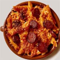 Macarrones Con Chorizo · Baked penne pasta with tomato, chorizo, and Manchego cheese