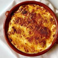 Canelones Gratinados Con Foie · Rolled pasta stuffed with chicken, pork and duck foie gras, baked with béchamel and Manchego...