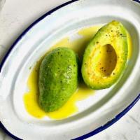 Side Aguacate Alinado · Whole avocado seasoned with extra virgin olive oil, salt and pepper