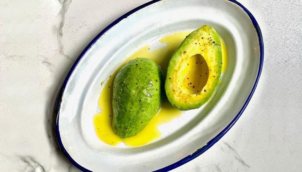 Side Aguacate Alinado · Whole avocado seasoned with extra virgin olive oil, salt and pepper