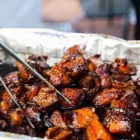 Filipino Pork Belly Burnt Ends · Cherry smoked heritage breed pork belly that is then braised until fork tender in a candy-li...