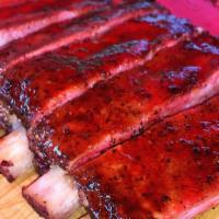 Louis Candied Pork Ribs · Cherry smoked heritage breed St. Louis cut pork ribs that are finished with a vanilla bean c...
