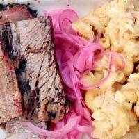 King In The North · 6 oz. of our prime beef brisket served alongside smoked gouda mac 'n' cheese, pickled red on...