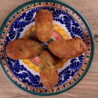 Jalapeños Rellenos Appetizer · 4 breaded jalapeños stuffed with fresh cheese.