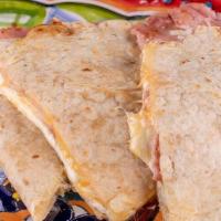 Sincronizadas · grilled flour tortillas filled with Oaxaca, mozzarella cheddar cheese & ham.