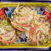 Tostadas · 3 Hard shell Tortillas topped with your choice of meat. Spread with beans, Mexican cream & f...