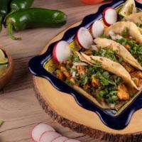 Taquisa · 30 Soft shell Tacos filled with your choice of meat. Topped with onion & cilantro. Accompani...