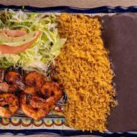 Camarones Asados · Grilled shrimp accompanied with rice, black beans, fresh salad & 5 homemade tortillas.