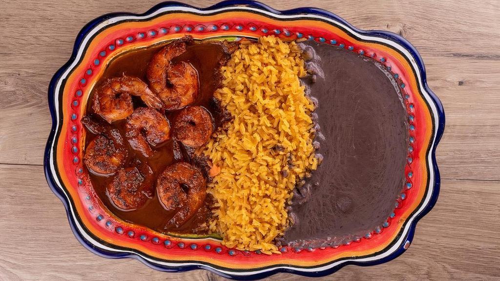 Camarones A La Diabla · Grilled shrimp marinated in chipotle sauce accompanied with rice, black beans, fresh salad & 5 homemade tortillas.