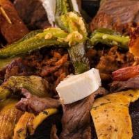 Molcajete · Our house specialty contains grilled steak, chicken, spicy pork, Cecina, sausage, grilled sh...