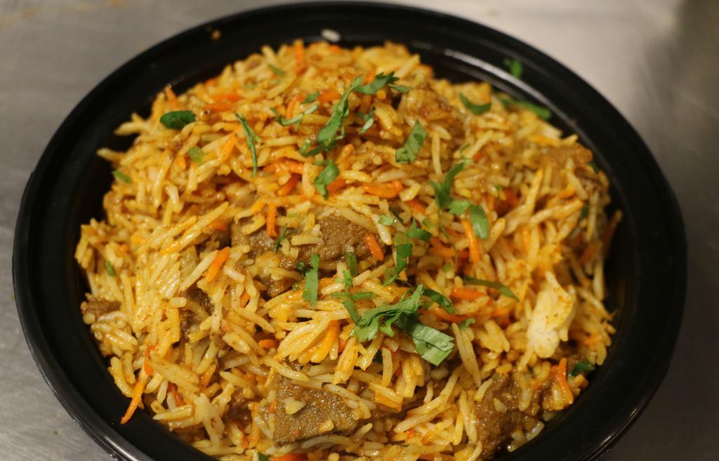 Mutton Biryani · Basmati rice cooked with baby goat,lamb and spices.